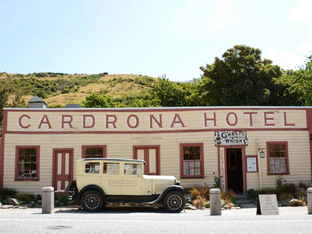 Historic Cardrona Hotel with vintage car parked outside